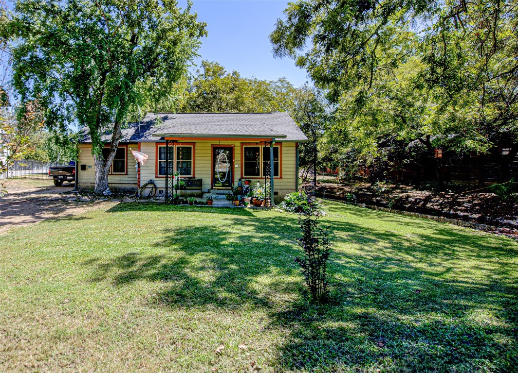 a view of a house with a yard porch and sitting area