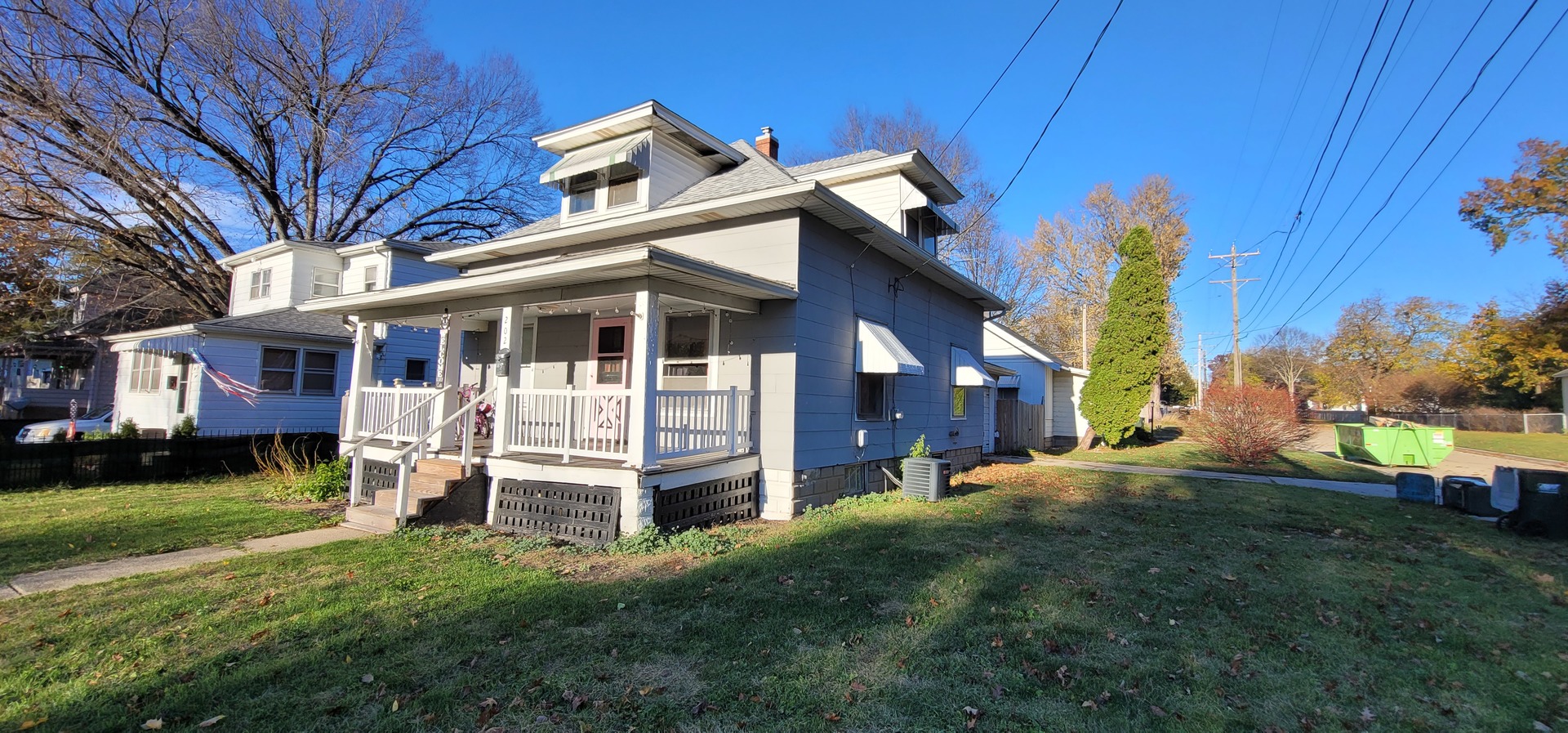 a view of a house with a yard porch and sitting area