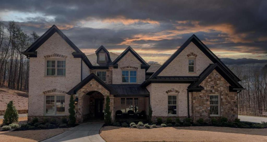 a front view of a house with garage