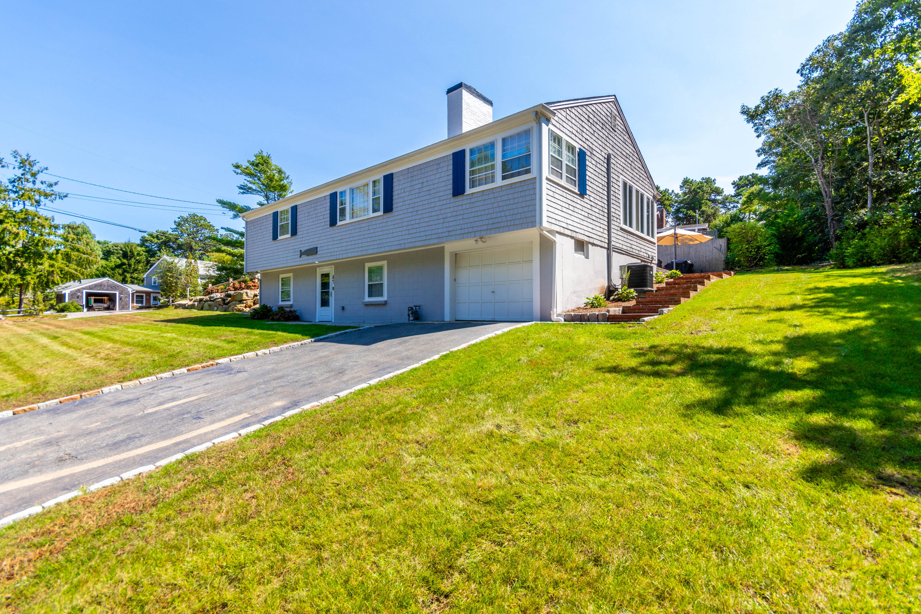 a front view of a house with a yard