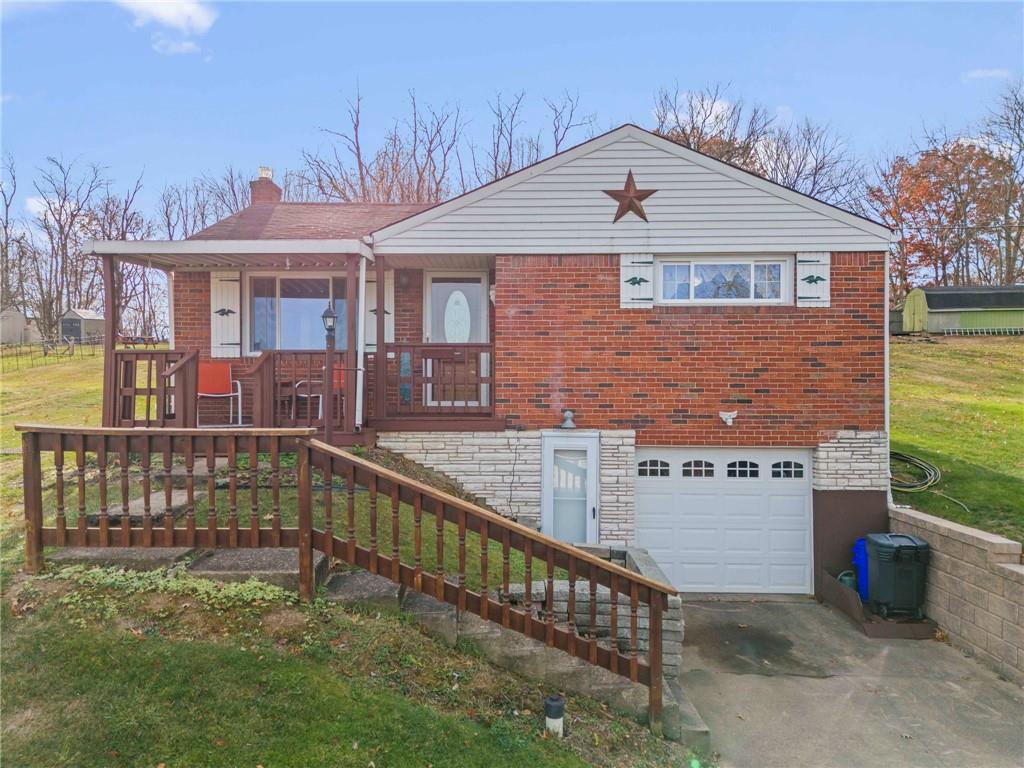 a view of a house with wooden deck