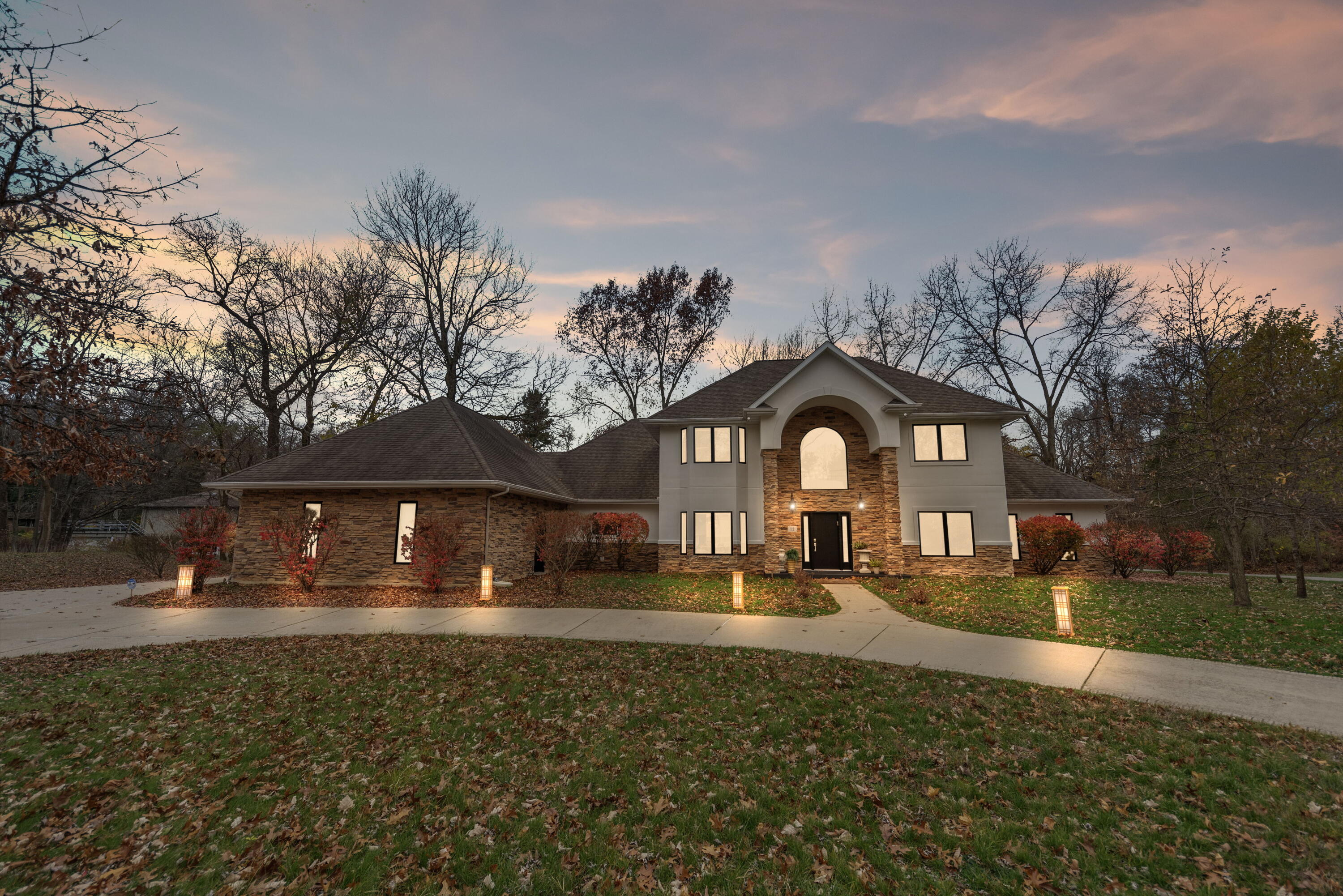 a front view of a house with a yard