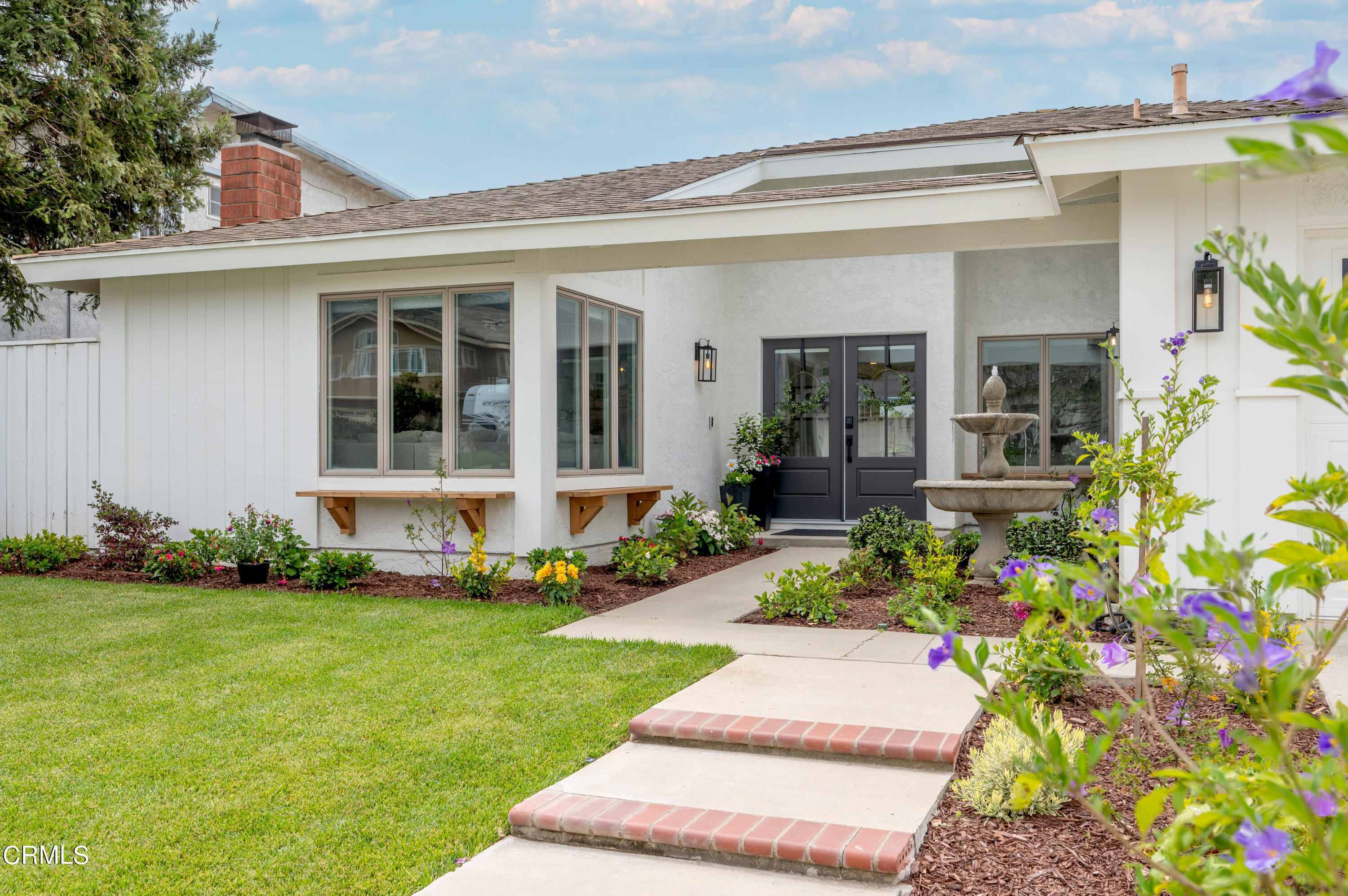 front view of a house with a yard