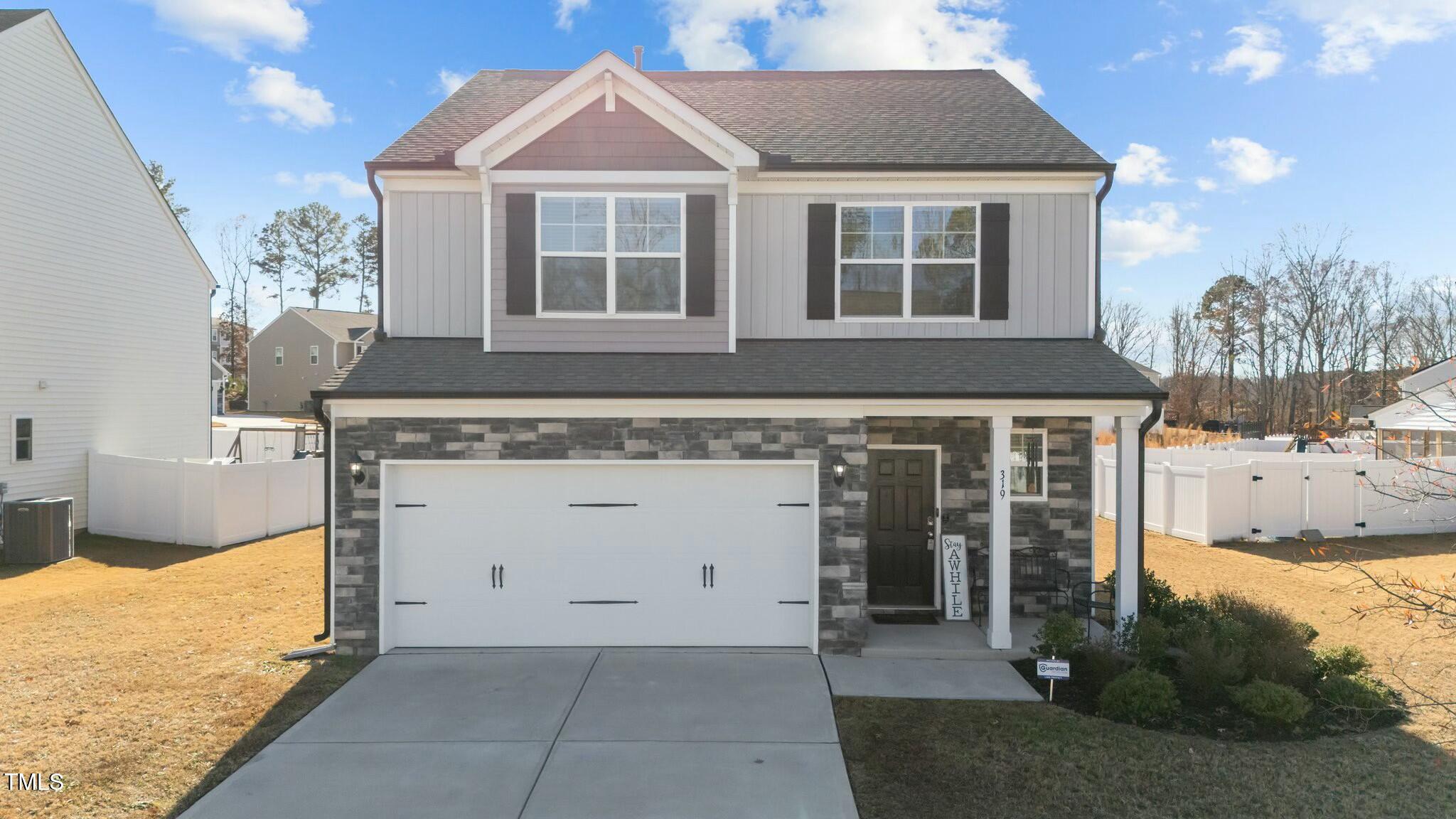 a front view of a house with yard