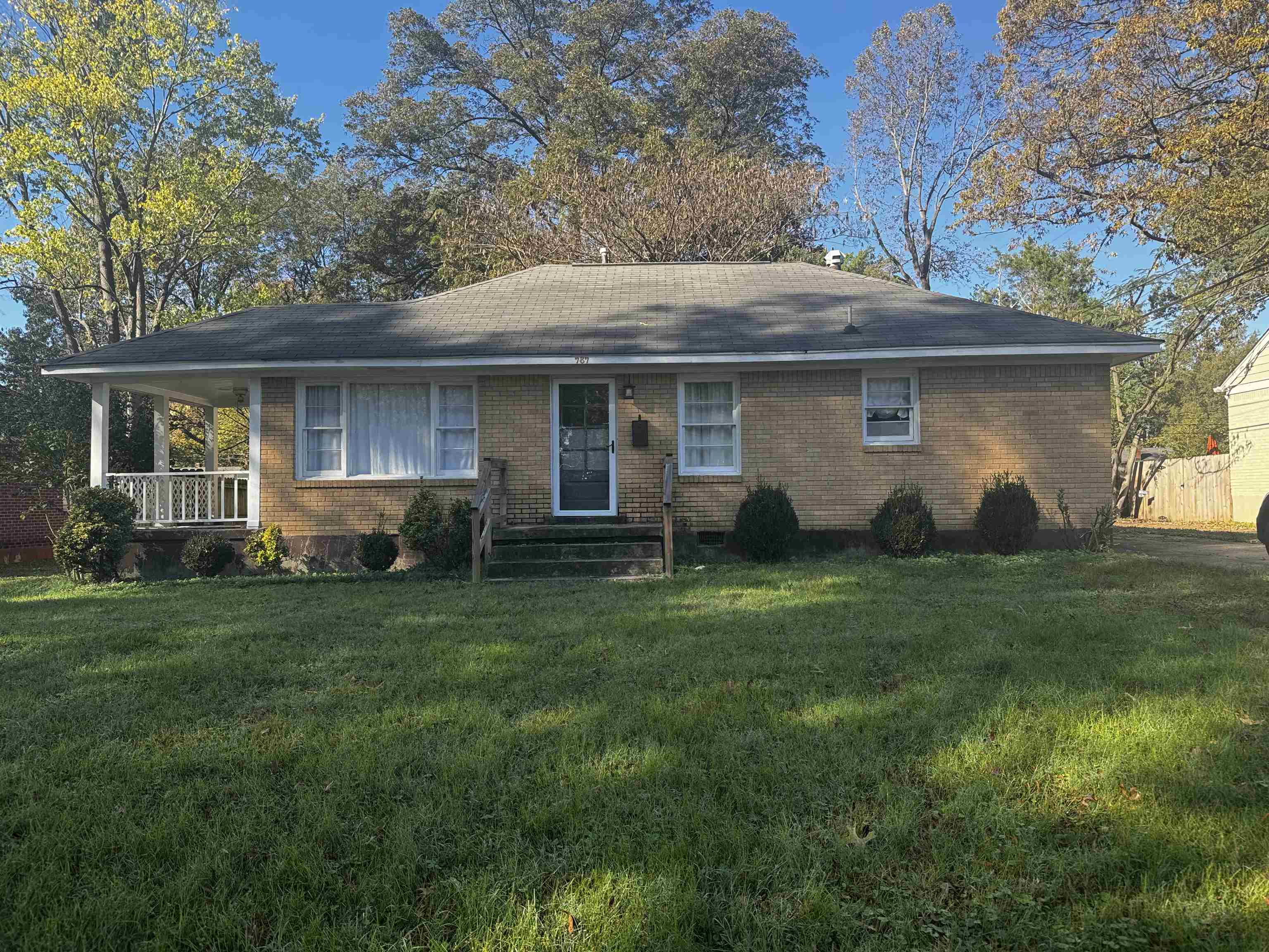 a view of a house with backyard sitting area and garden