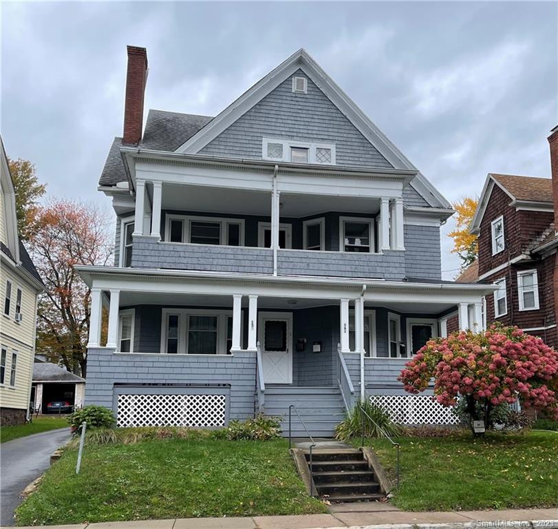 front view of a house with a yard