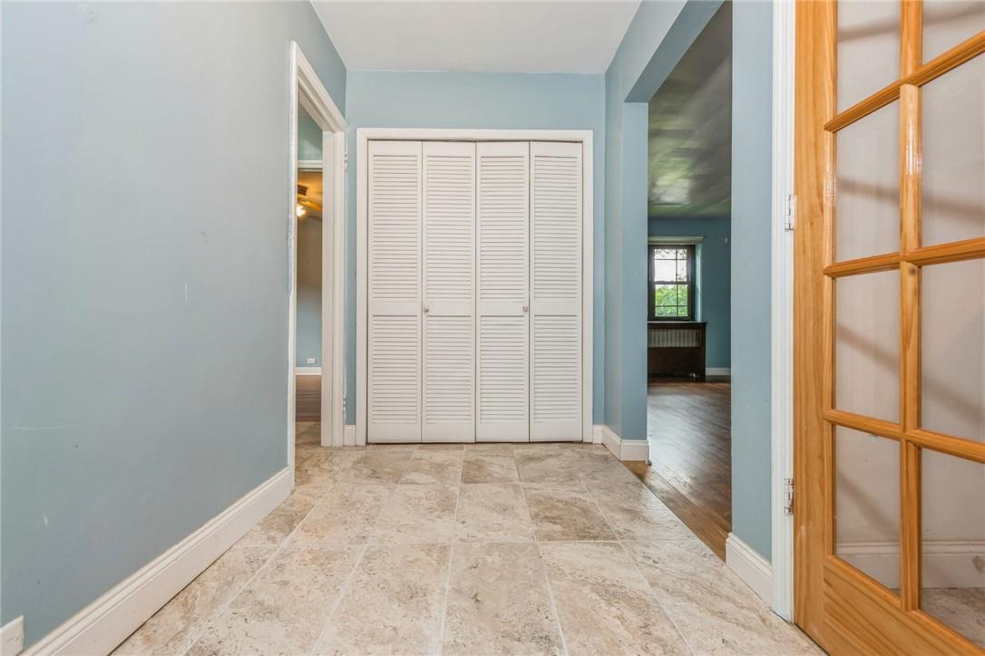 Unfurnished bedroom featuring light wood-type flooring and a closet