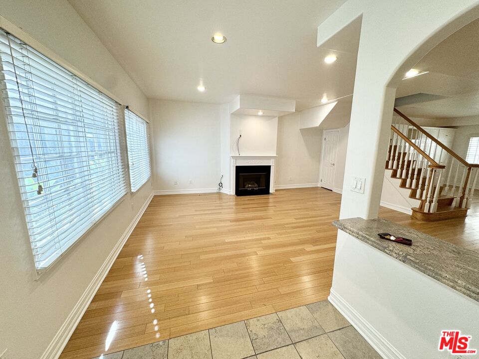 a view of a kitchen with a sink and cabinets