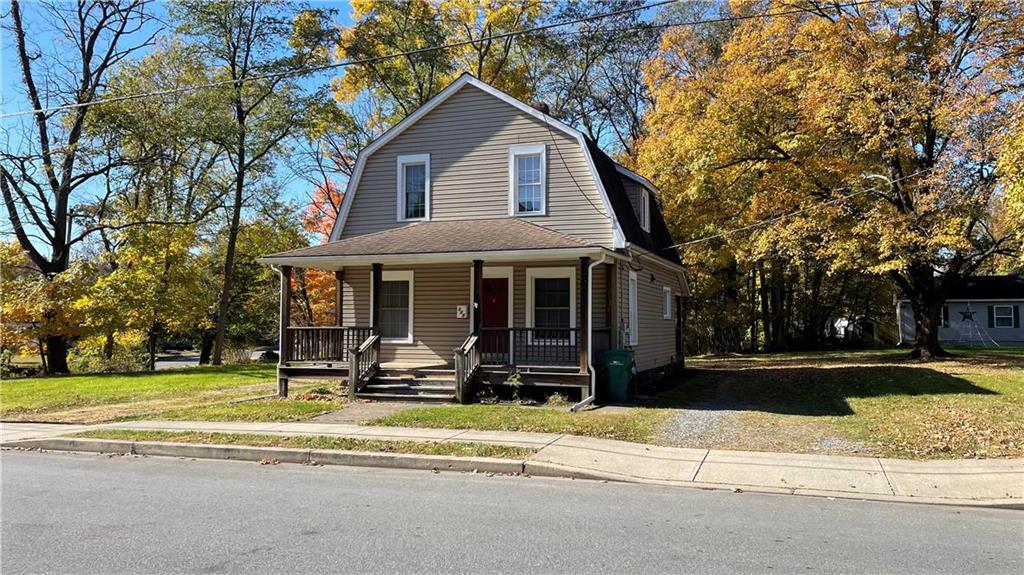 a front view of a house with a yard