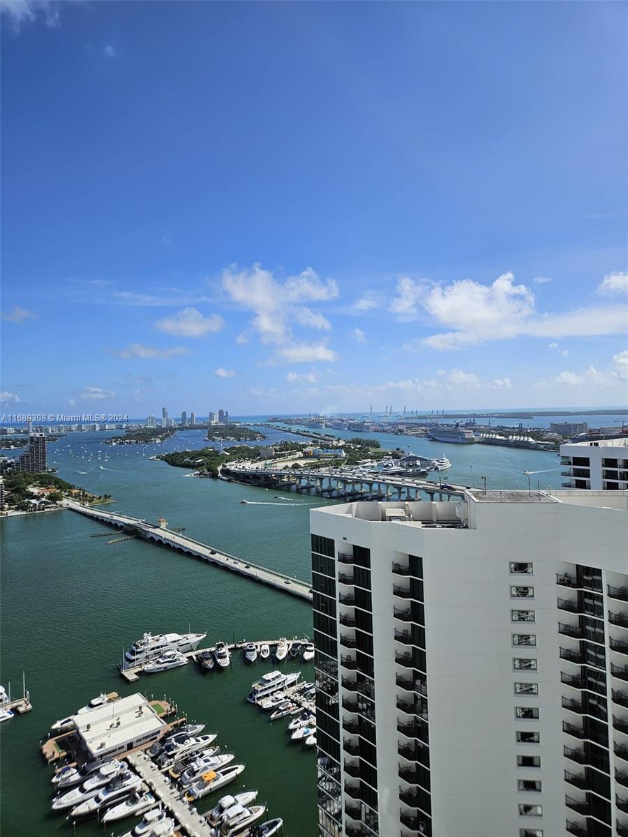 a view of a lake with tall buildings