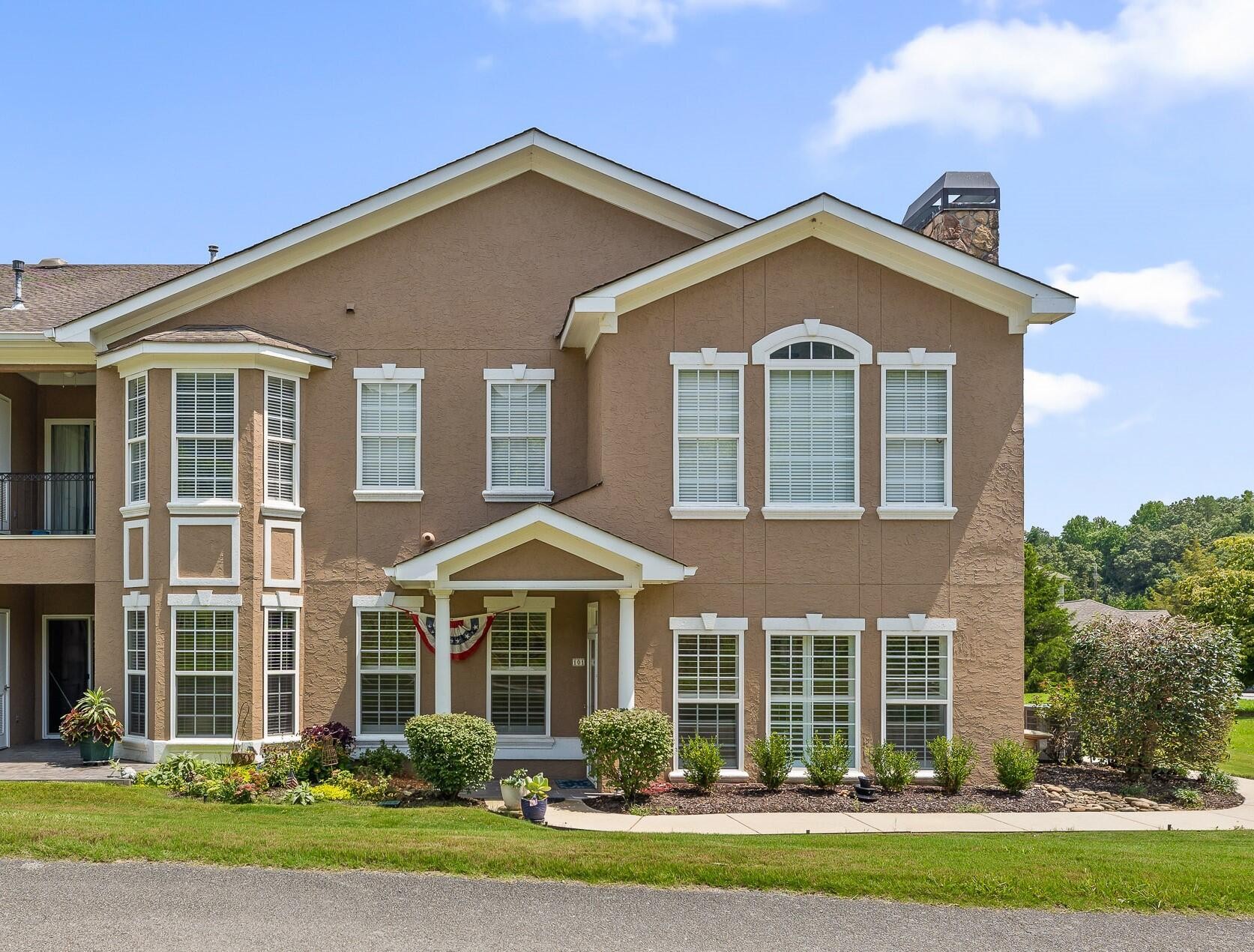 front view of a house with a yard