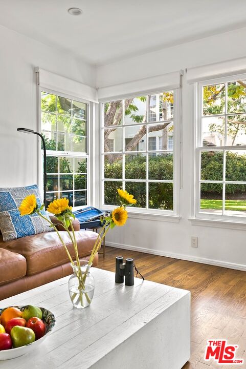 a kitchen with dining table and a large window