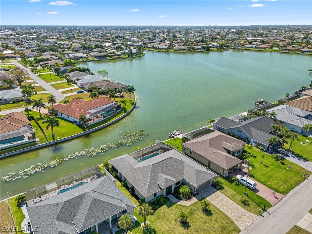 an aerial view of a house with a lake view