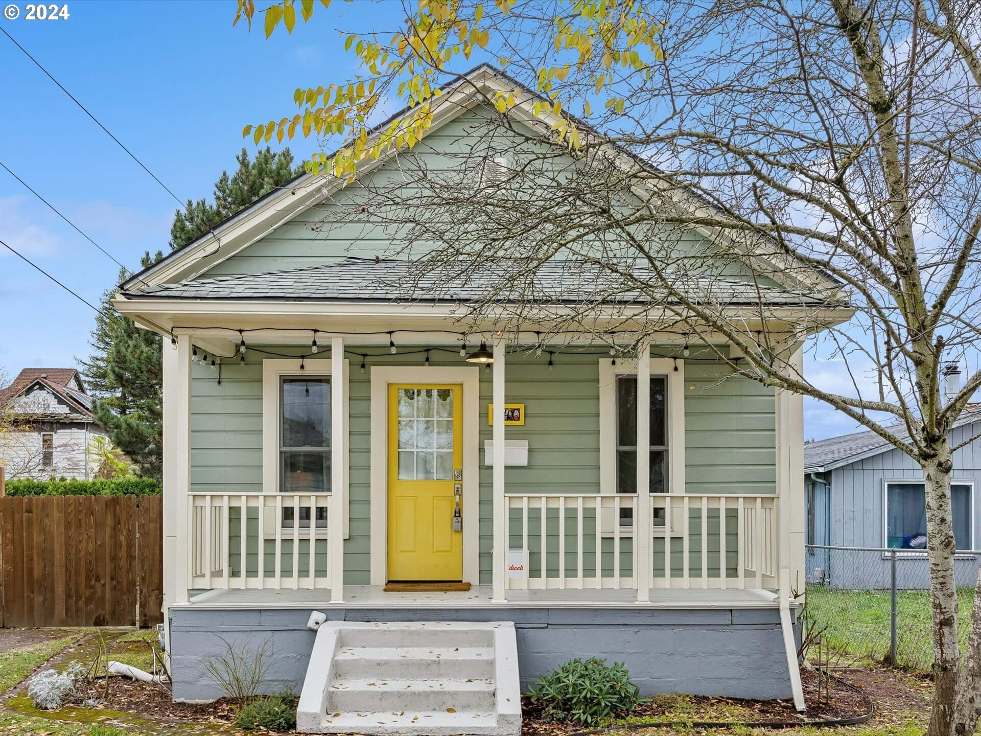 a front view of a house with a garden