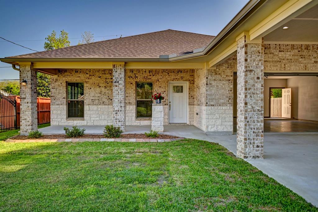 front view of a house with a yard