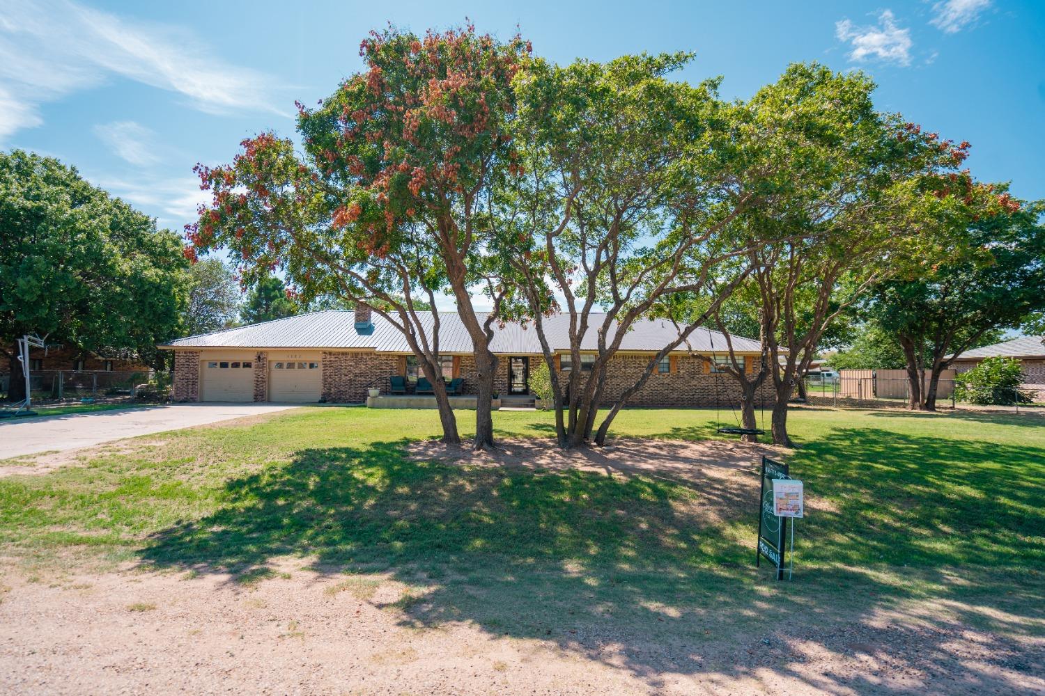 a house with trees in the background