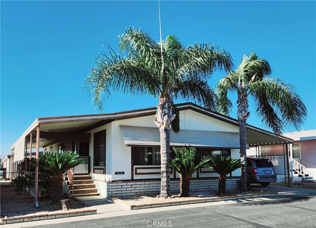 front view of a house with a potted plants