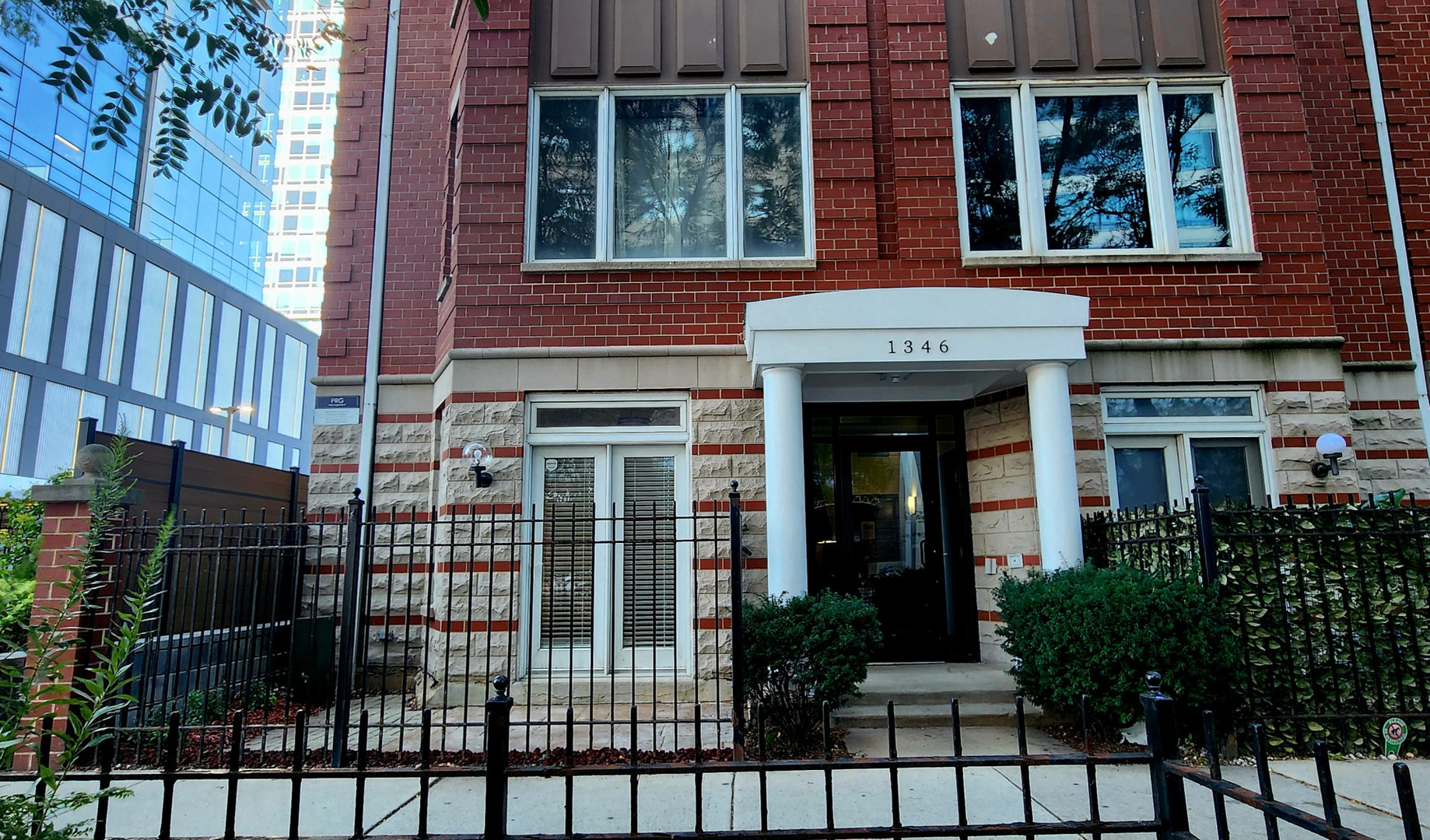 front view of a brick house many windows