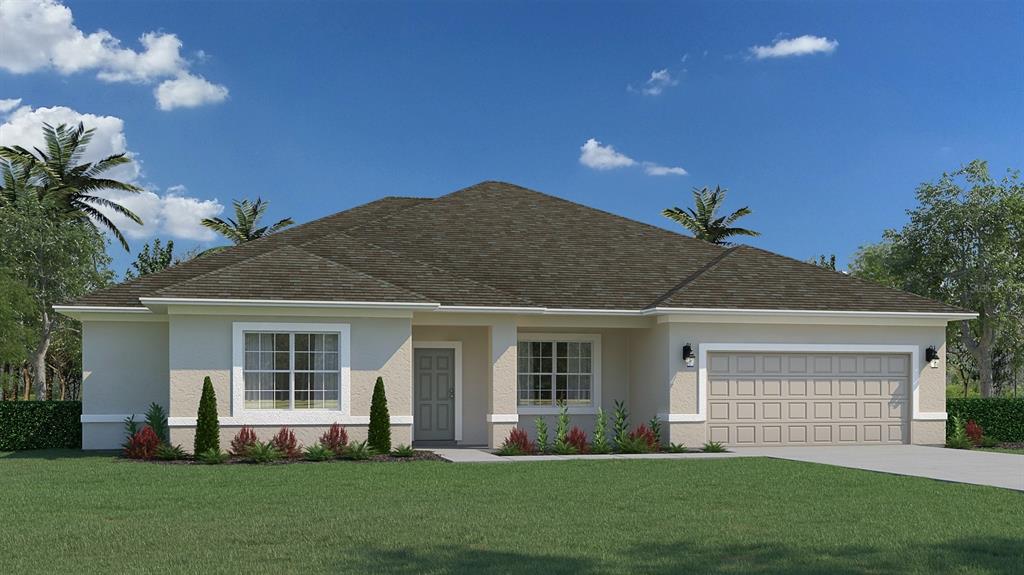 a front view of a house with a garden and yard