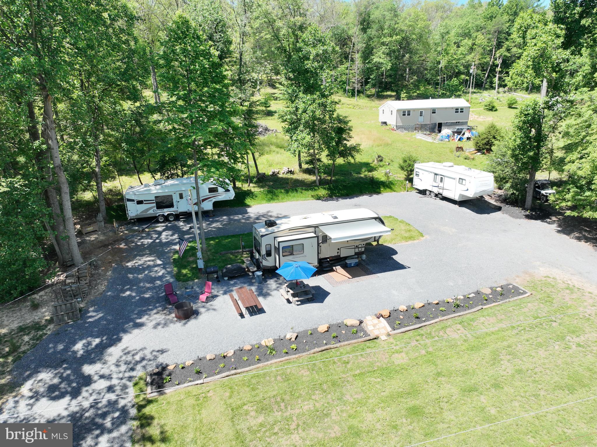 an aerial view of a house with garden space and street view