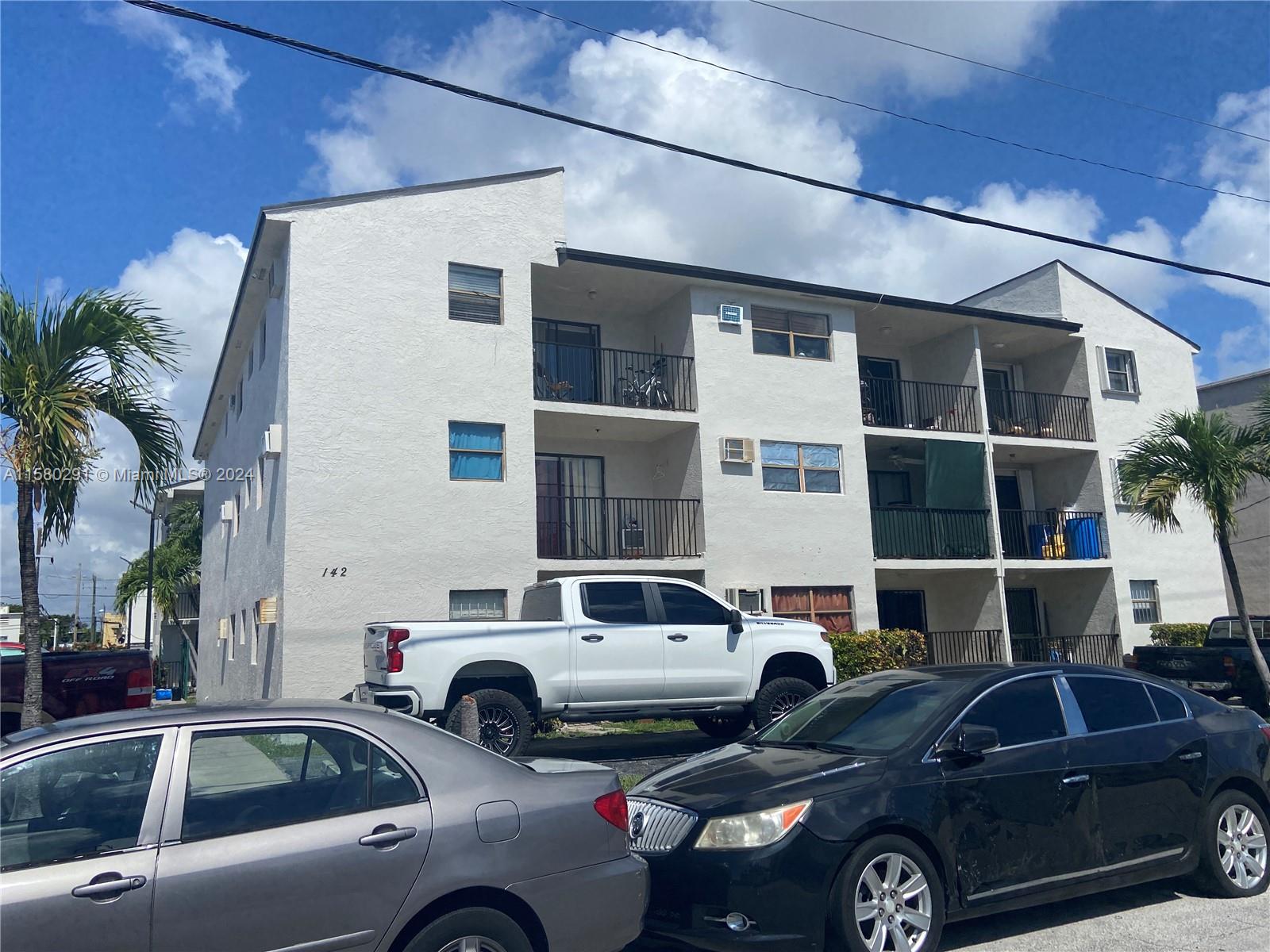 a front view of a house with parking space