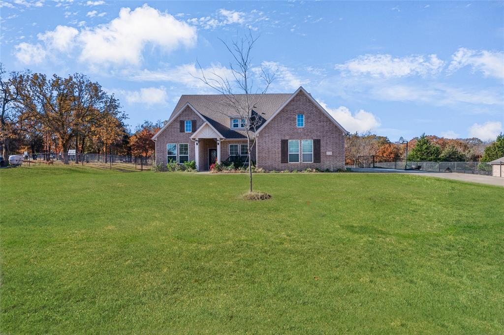 front view of a house with a yard