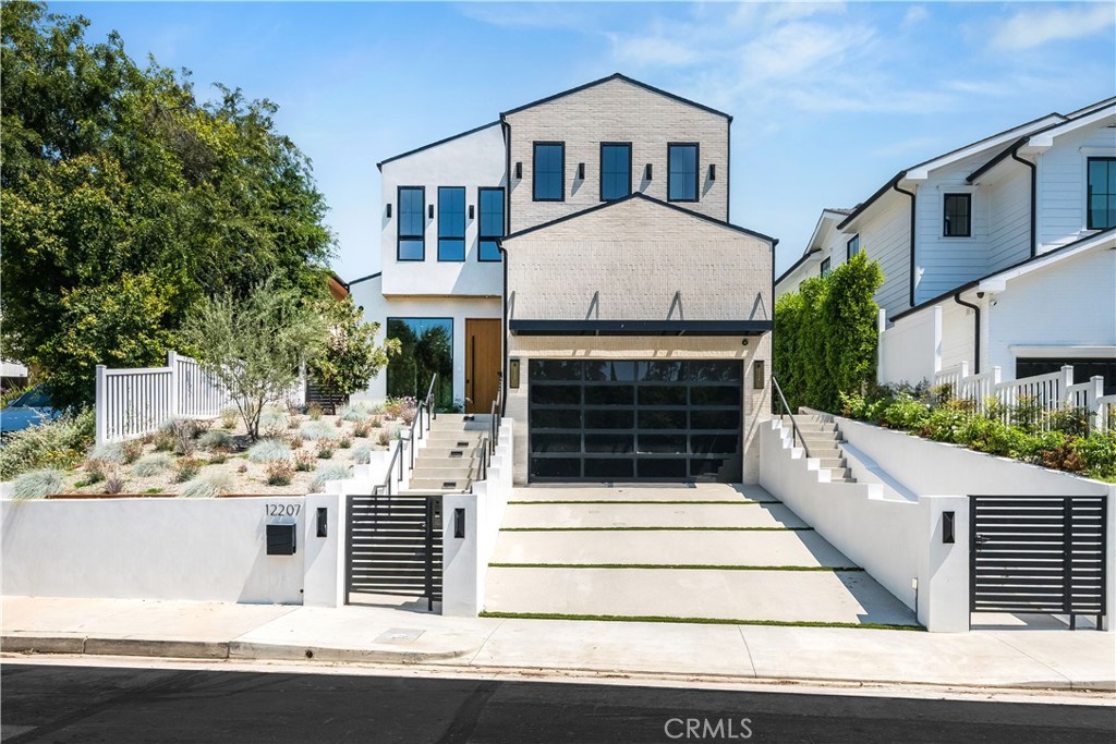 a front view of a house with a garage