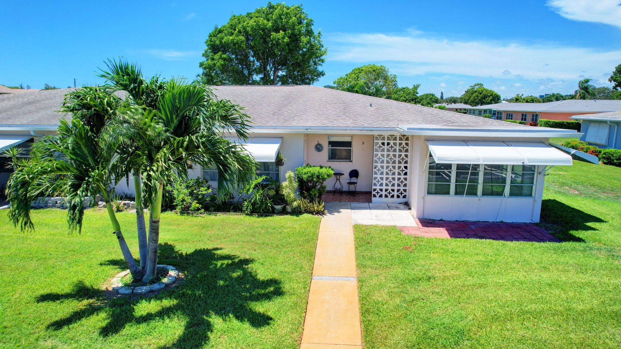 a view of house with a yard