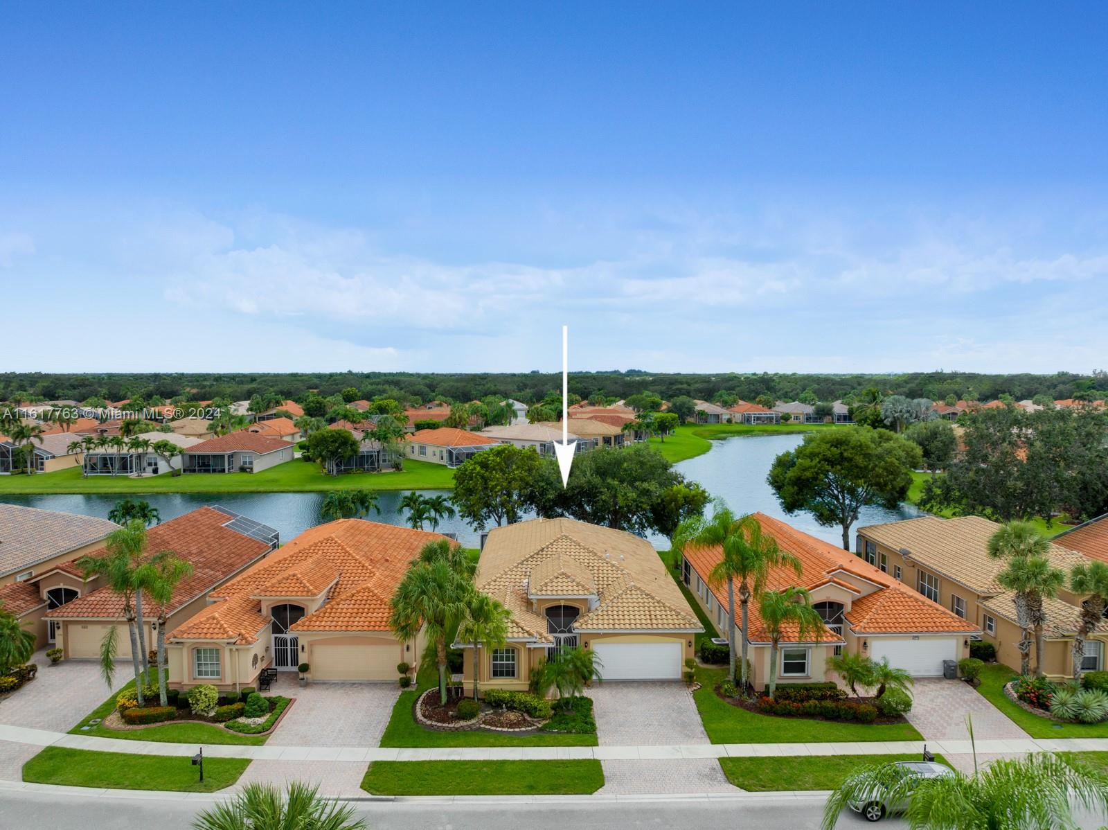 an aerial view of a house with garden space and street view