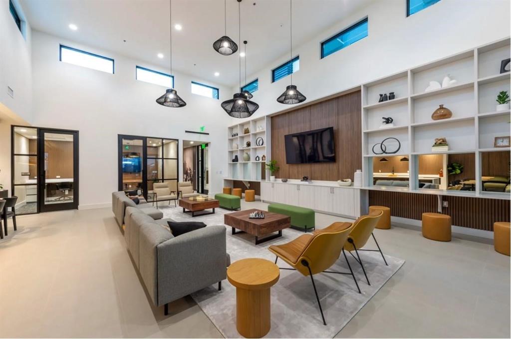 a living room with fireplace furniture and a flat screen tv