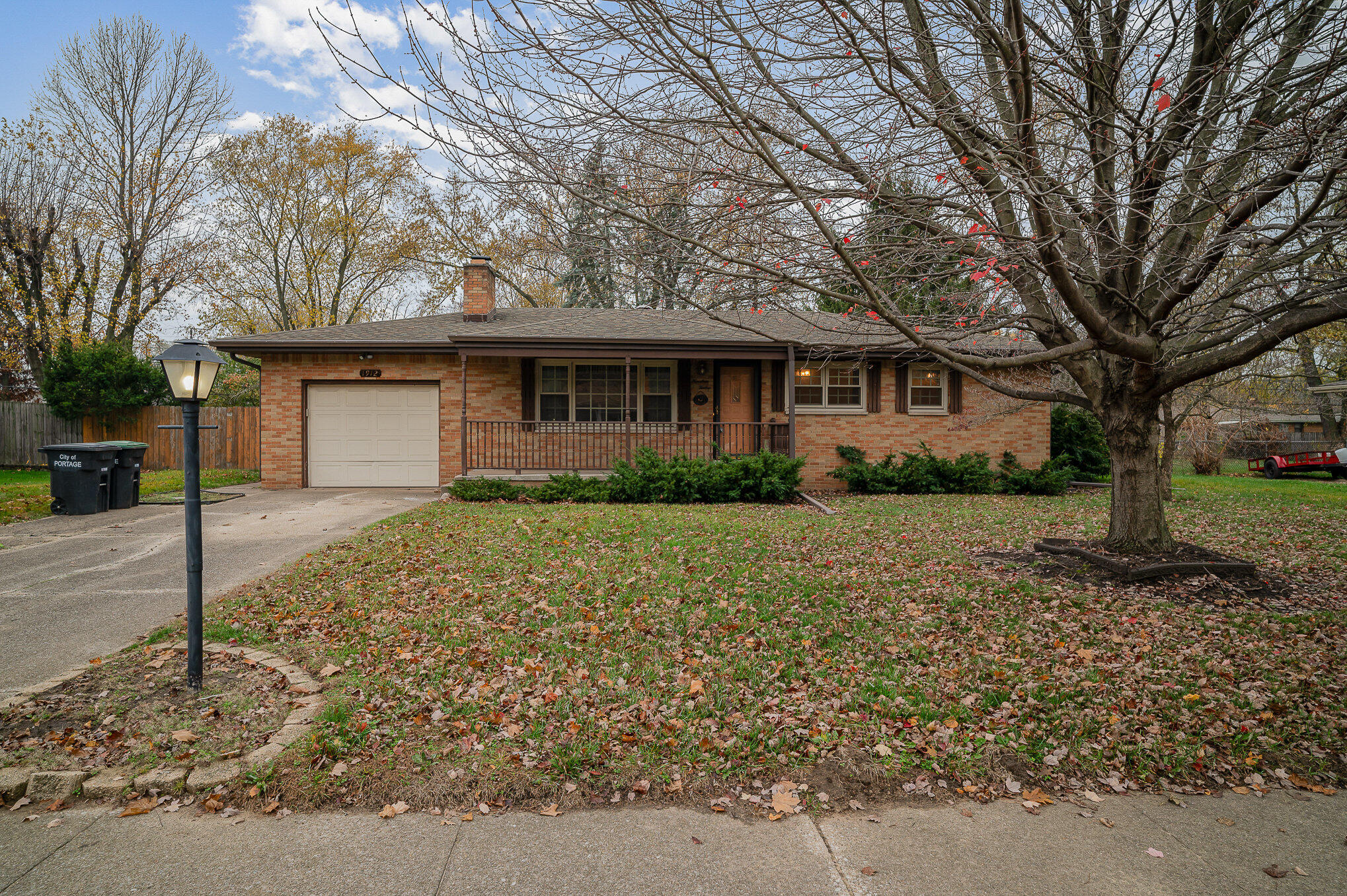 a front view of house with yard and trees