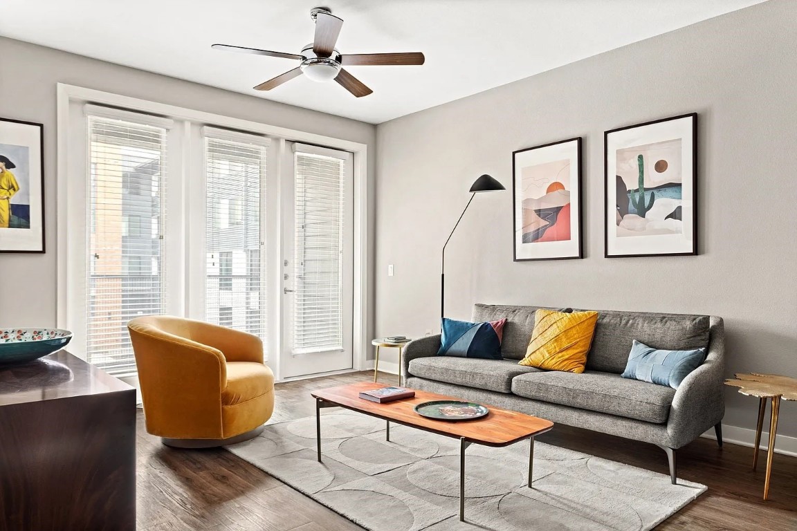 a living room with furniture and a large window