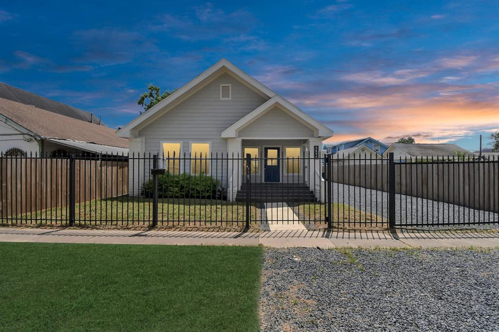 a view of a house with a fence