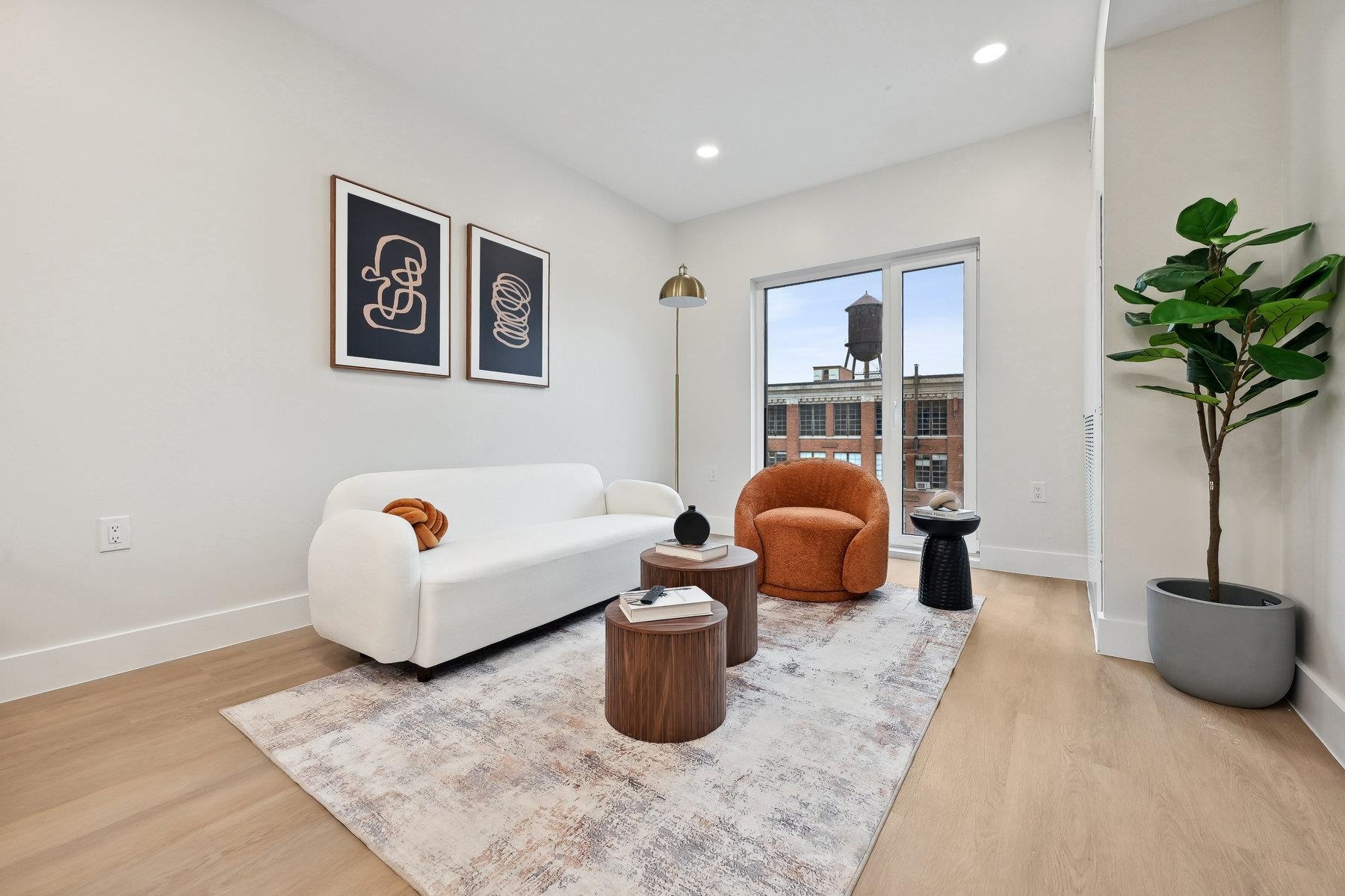 a bedroom with furniture and a potted plant