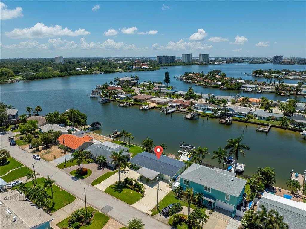 an aerial view of a house with a lake view