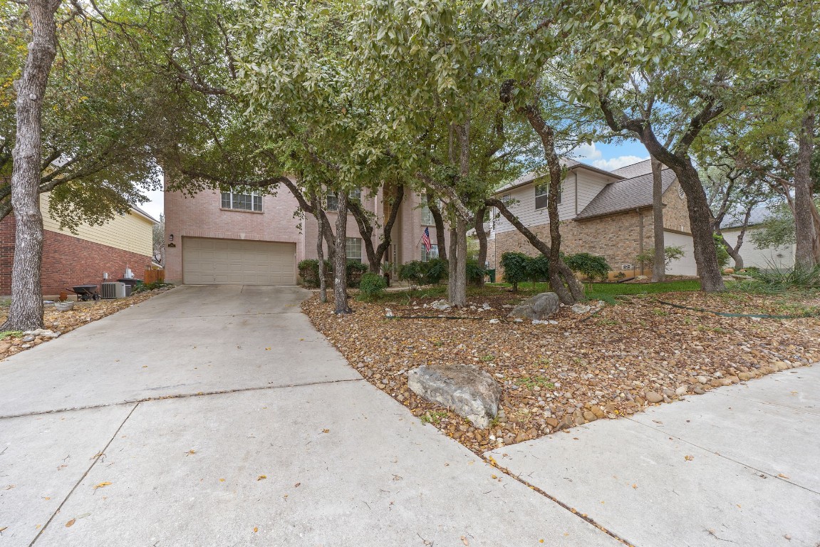 a backyard of a house with lots of trees