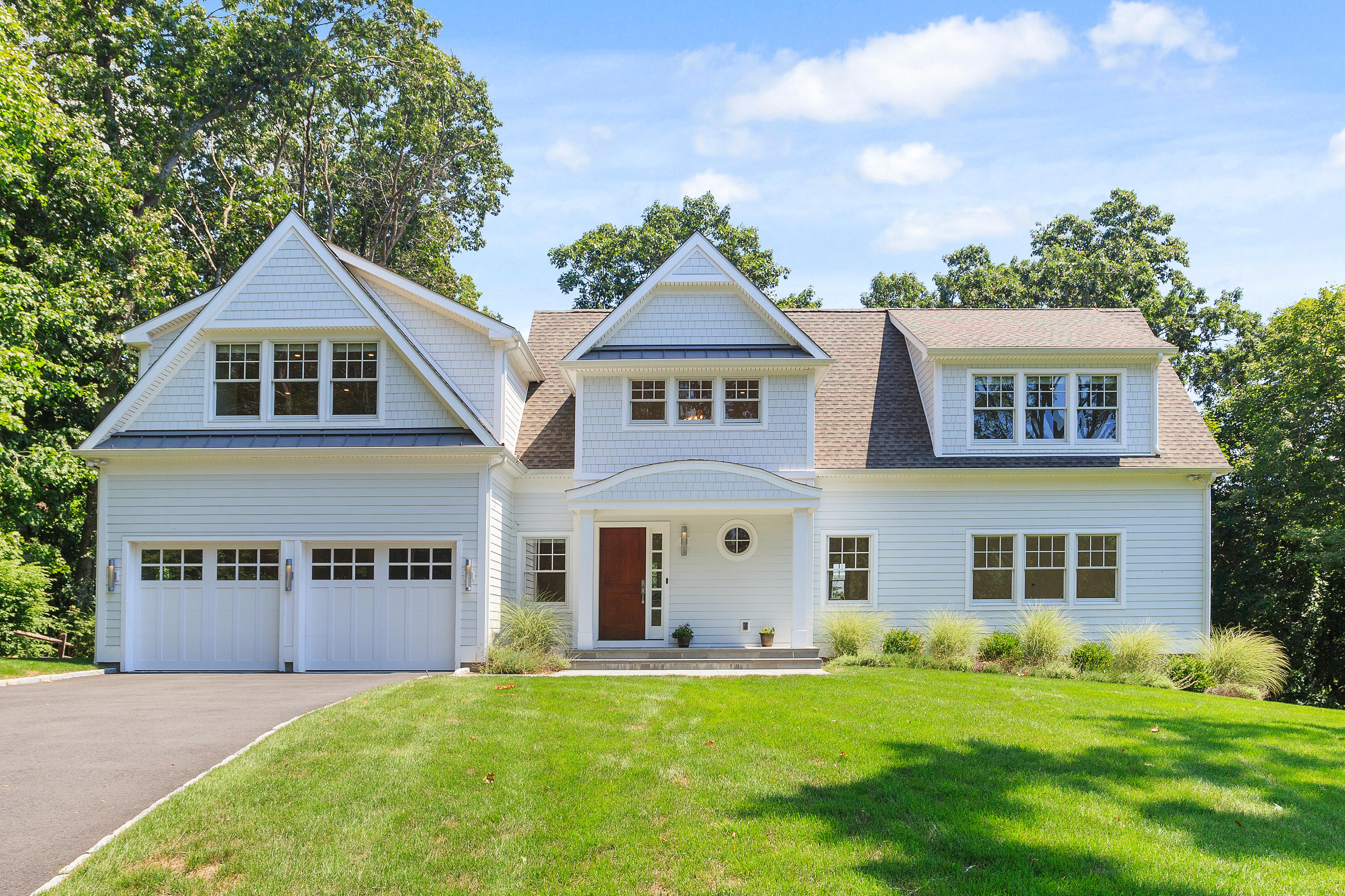 front view of a house with a yard