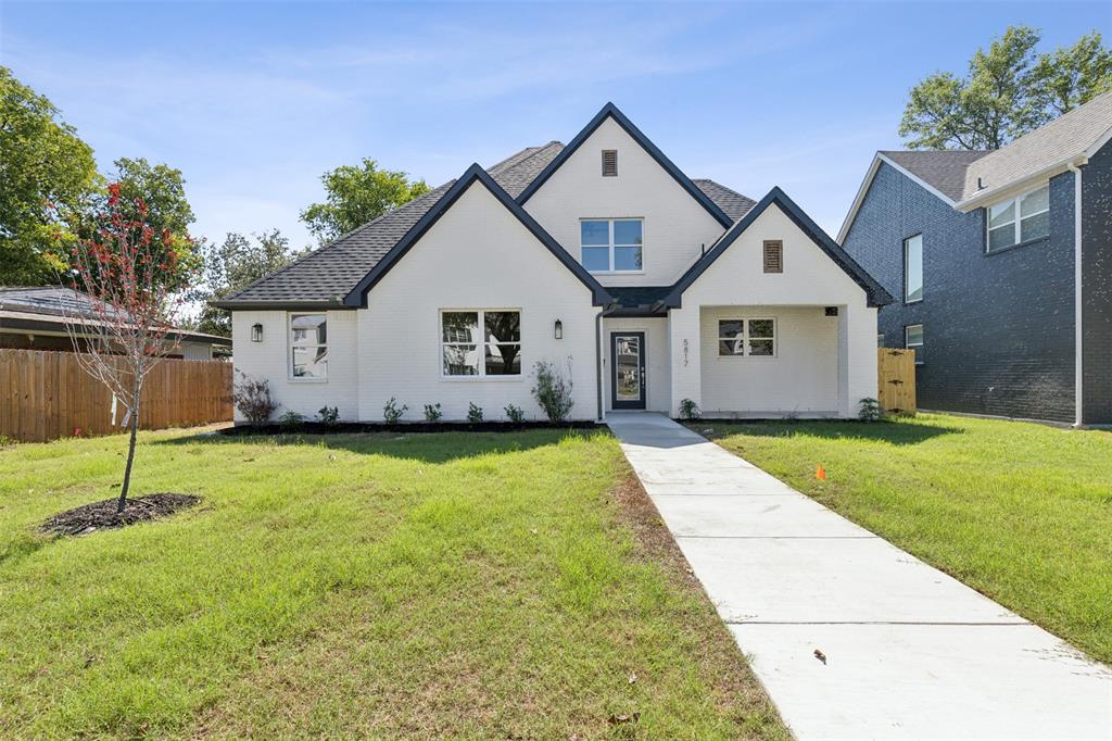 a view of a house with a backyard