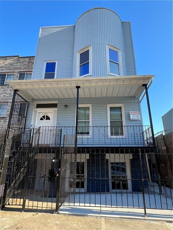 a front view of a house with glass windows