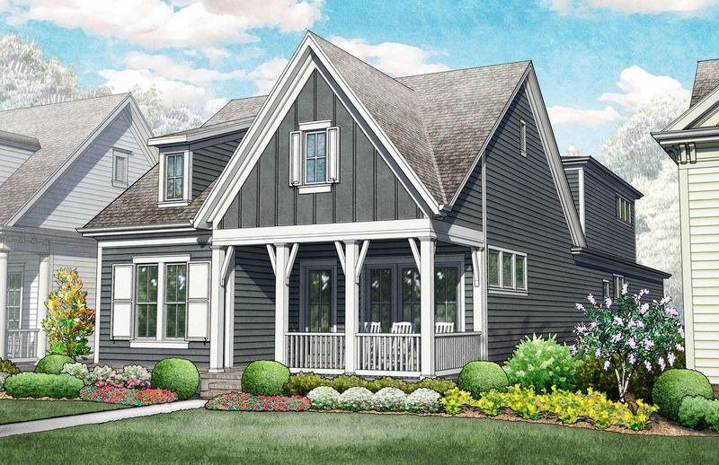 a front view of a house with a yard and potted plants