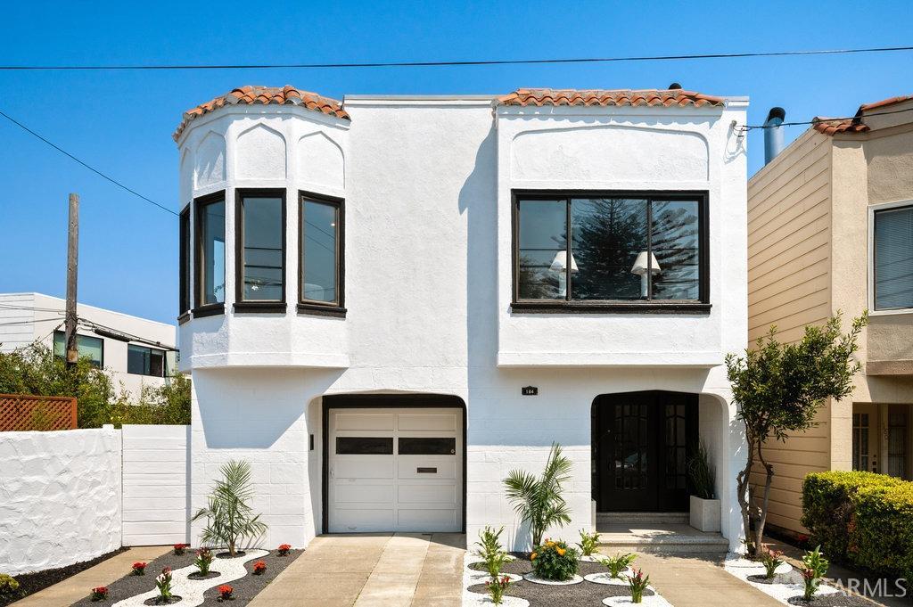 a front view of a house with a garage