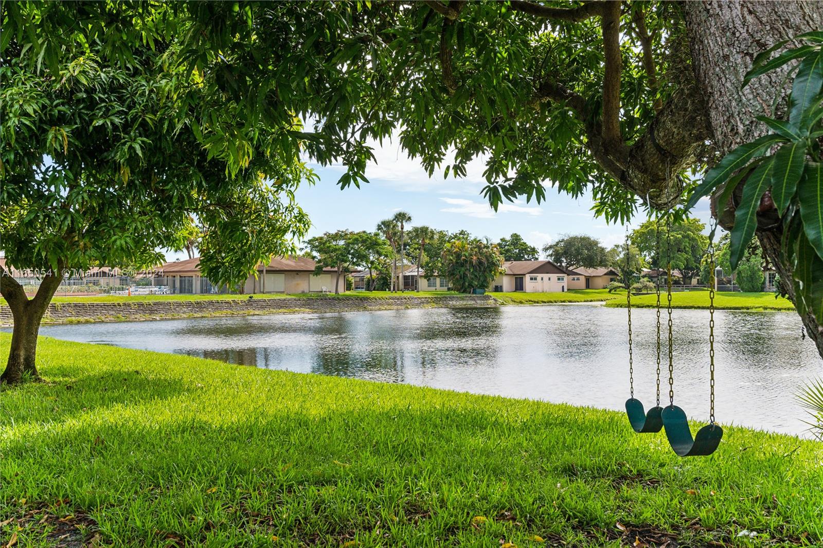 a view of lake with green space