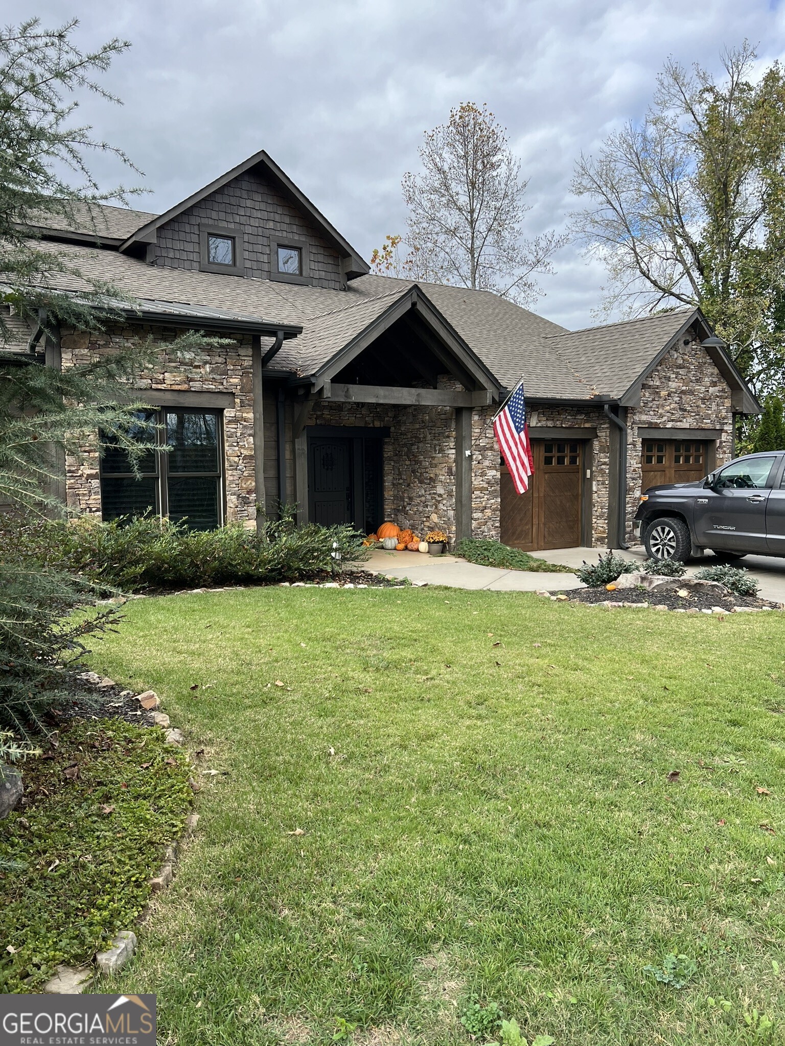 a front view of a house with a yard