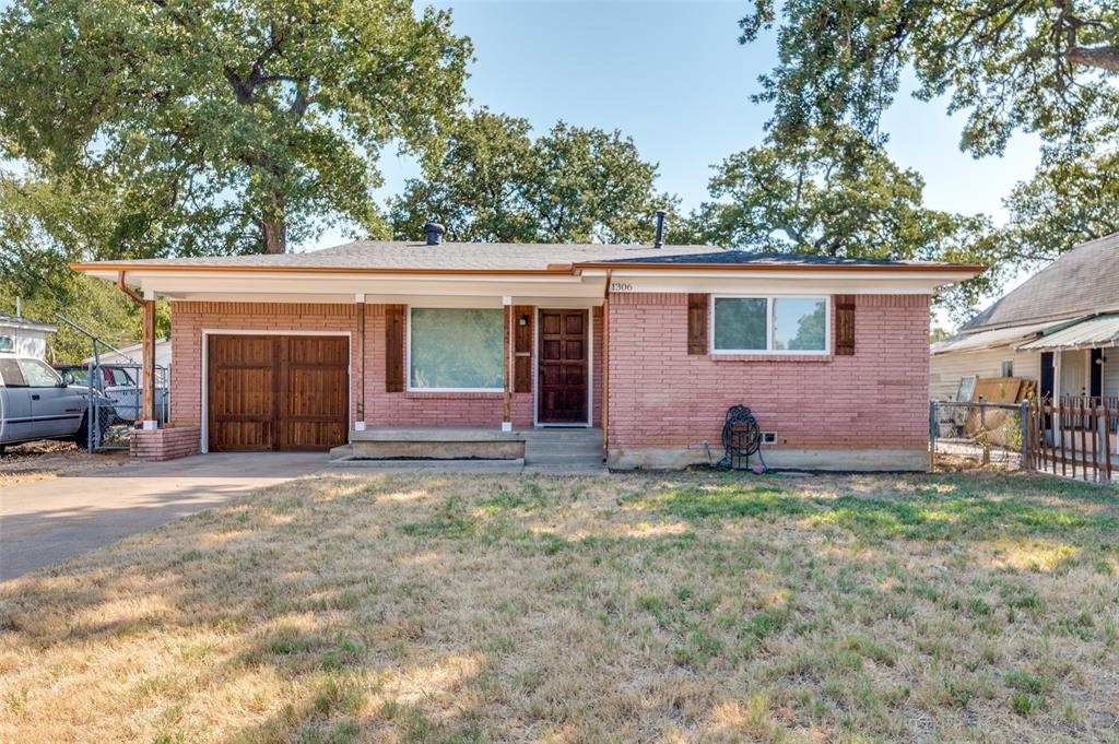 a house that has a tree in front of it