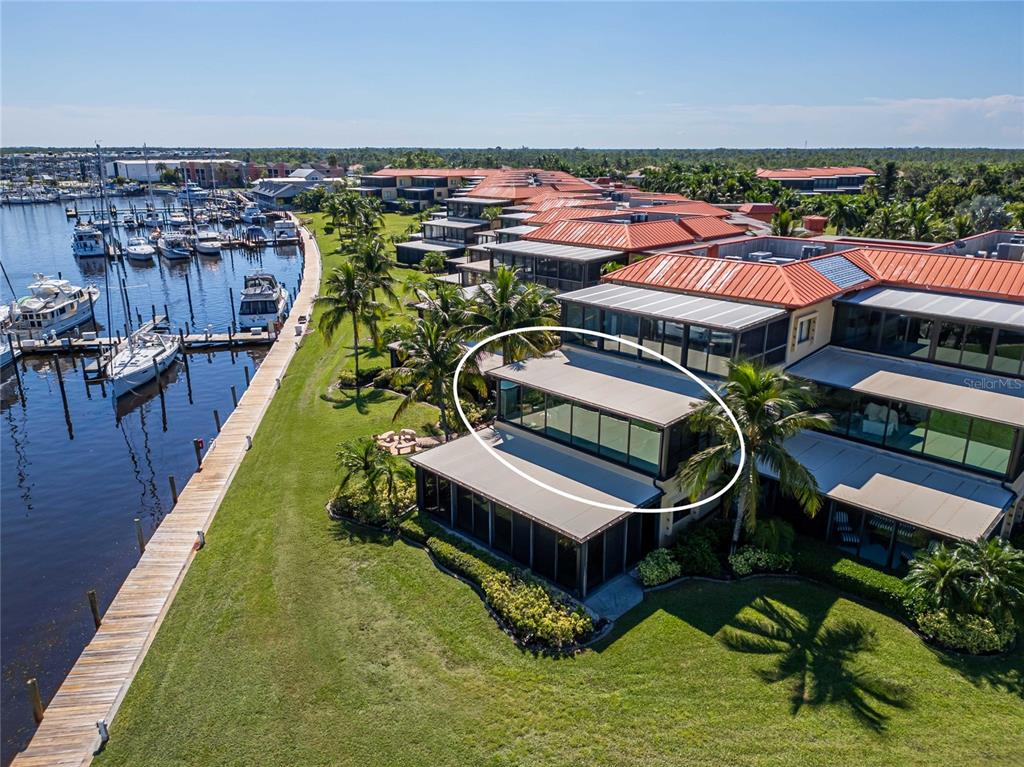 an aerial view of a house with swimming pool and outdoor space