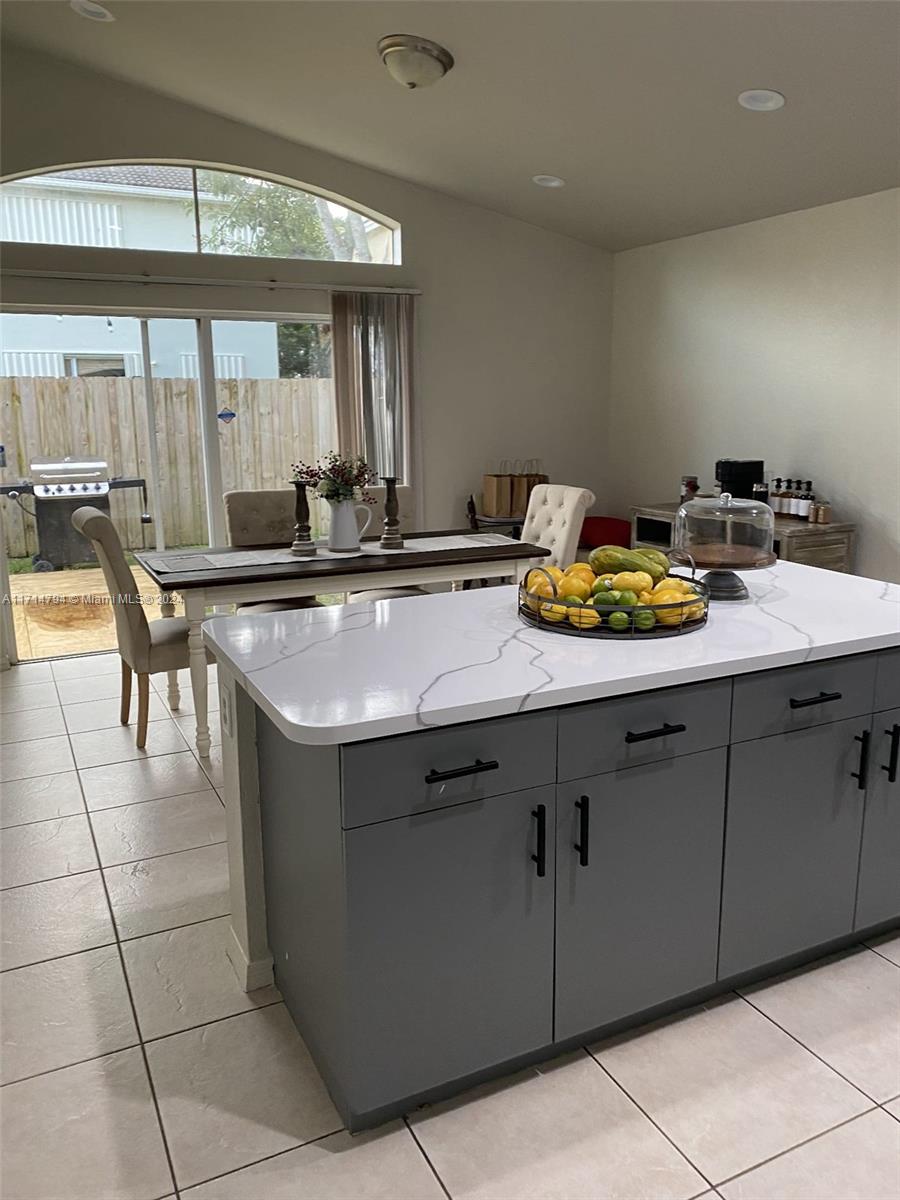 a kitchen with a cabinets and window