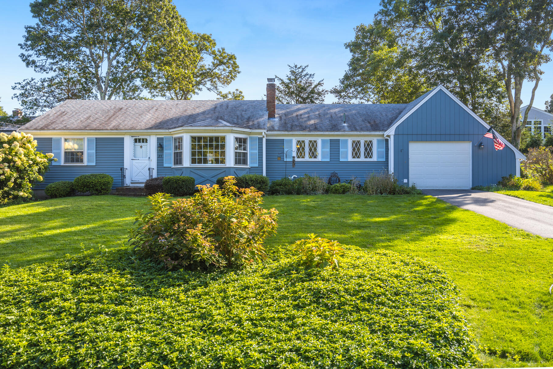 a front view of a house with garden