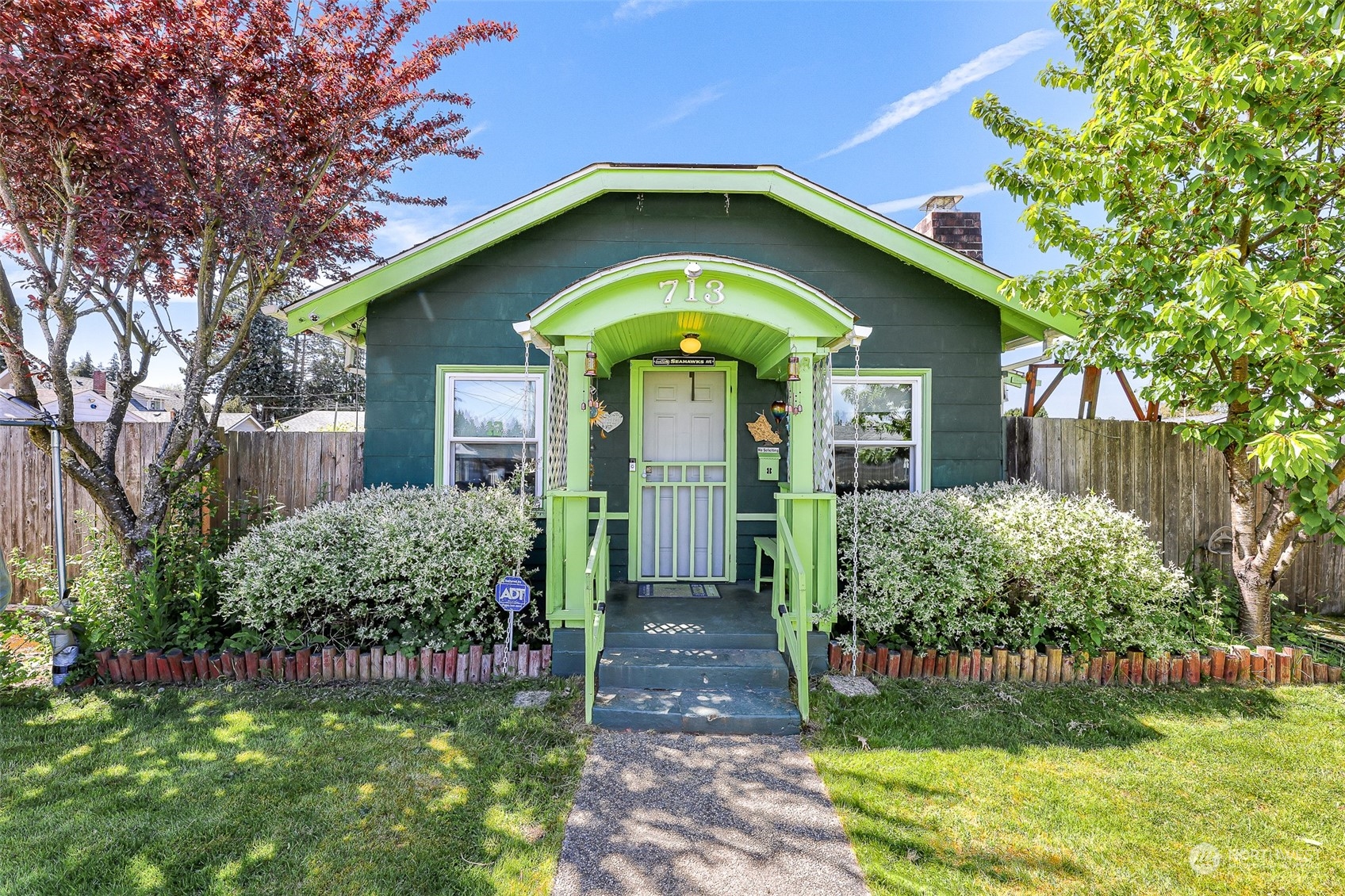 a front view of a house with garden