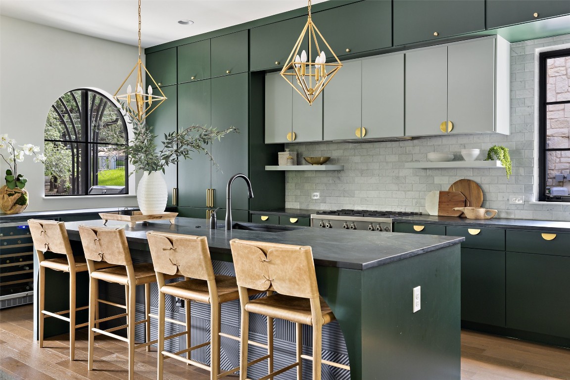 a kitchen with a sink cabinets and window