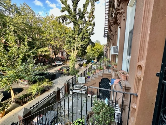 a view of a balcony with an outdoor space